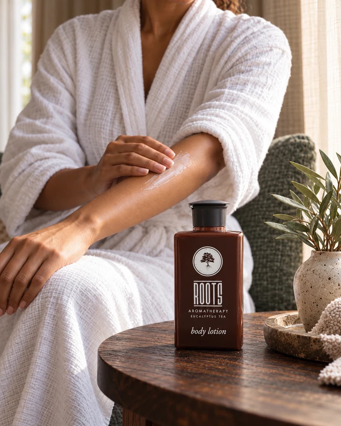 HE-manufactured ROOTS body lotion in an illustrative lifestyle setting