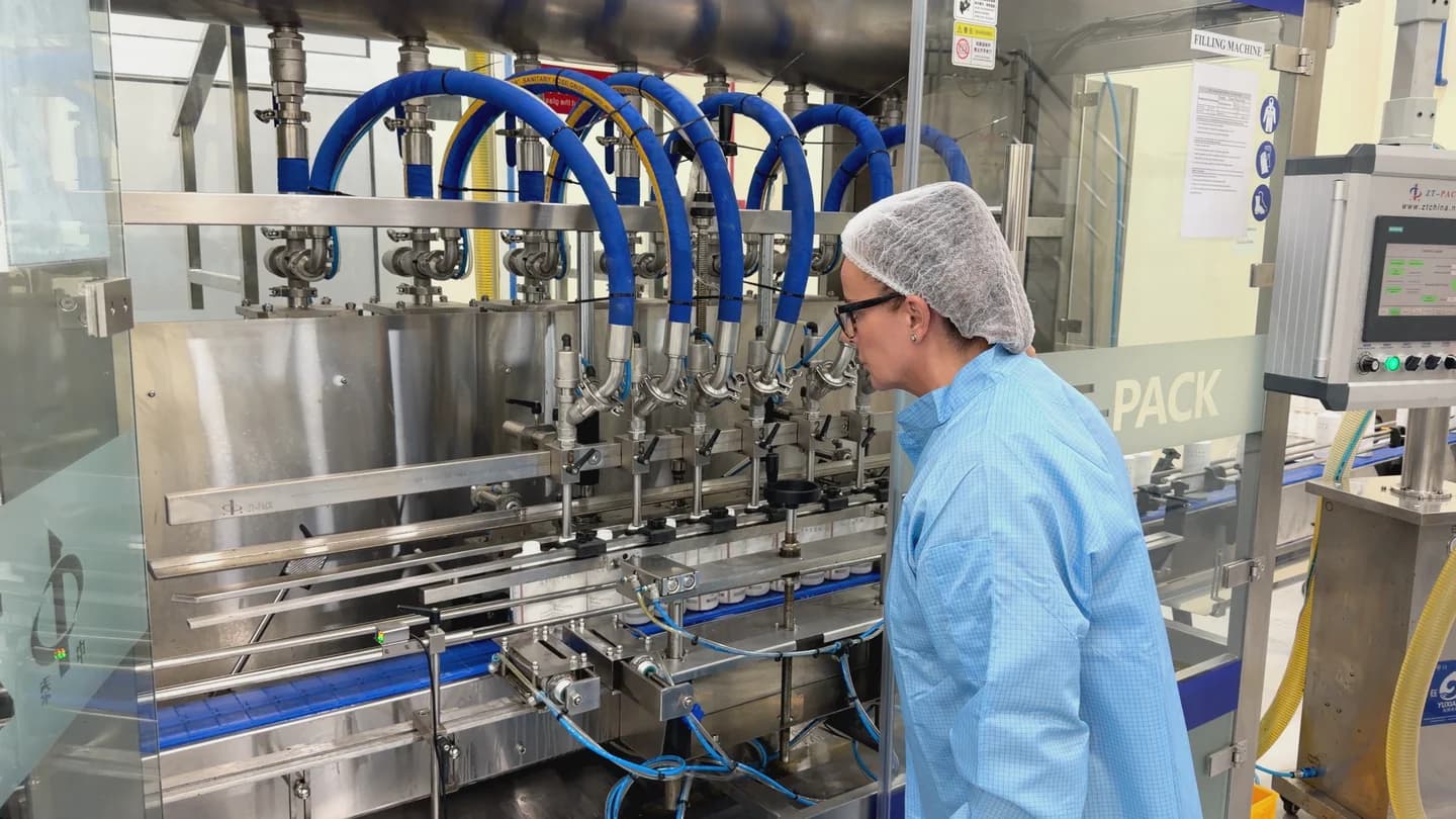 Elisa Polidoro inspecting the bottle filling line at HE Manufacturing