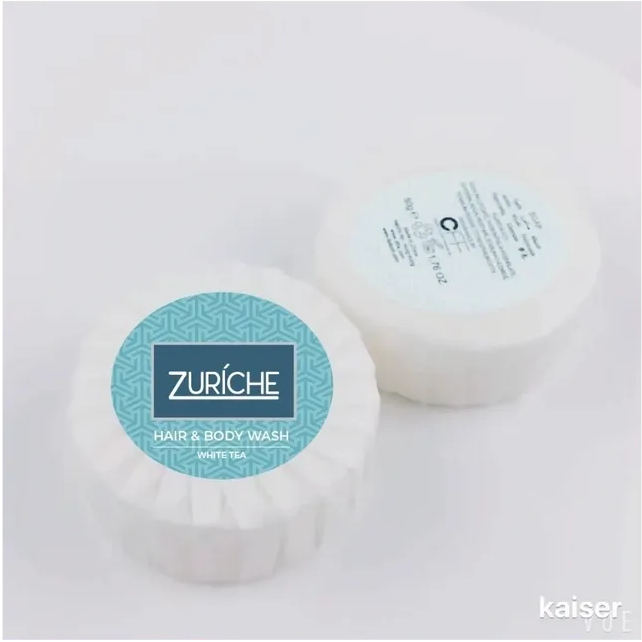 Two bars of Zuriche hair and body wash on a white background